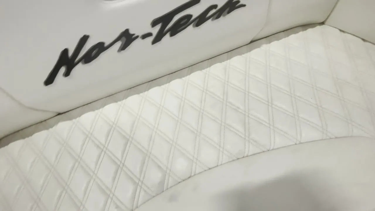 White diamond-stitched Nor-Tech 390 Sport interior, mid-build in the Rivers Refined shop